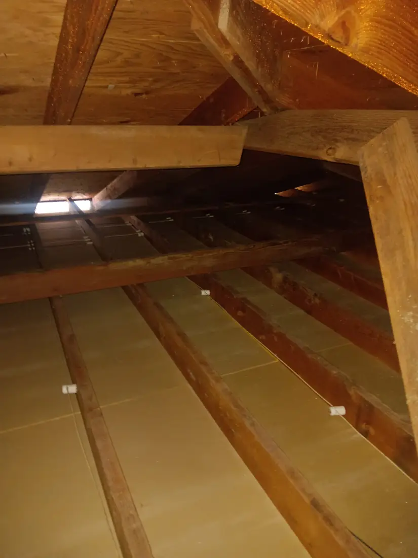Clean attic joists after full insulation removal