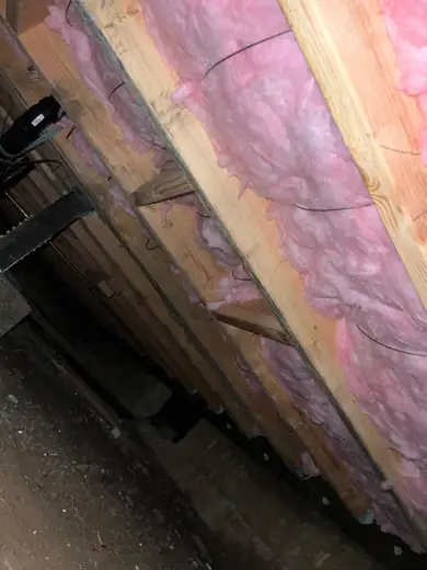 Batts between floor joists, crawl space view