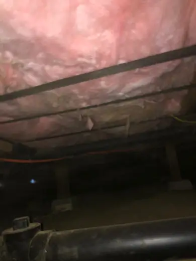 Underfloor insulation from inside the crawl space