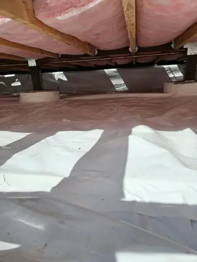 Vapor barrier covering the crawl space soil