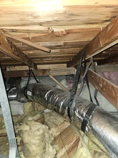 Old attic batts around ductwork before removal