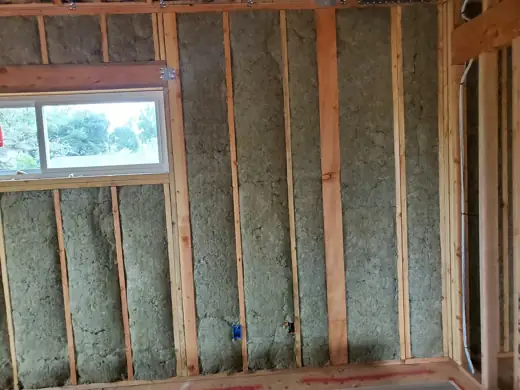 Wall batts fitted around a window